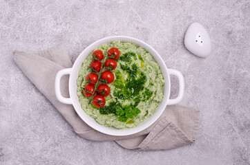 Mashed potatoes with tomatoes and green sauce