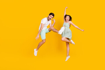 Fototapeta na wymiar Photo of crazy careless couple rejoice win attainment wear casual outfit isolated yellow color background
