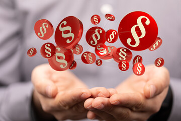 Hand hält Paragraphen Symbol