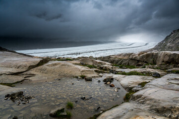 view over the strinking ice of the mighty Aletsch Glacier from Märjelen in the swiss alps