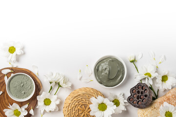 Natural clay mask dry and wet with flowers on a white background