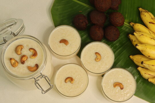 Rice puddings prepared in Kerala style. A popular dessert called palada pradhaman made with rice noodles, cashew nuts, coconut and sugar. Shot along with sweet rice fritters and banana