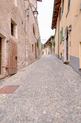 Old street of Monforte d'Alba, typical medieval village in the hilly region of Langhe (Piedmont, Northern Italy), UNESCO site since 2014.