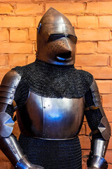 Old historical medieval iron knight armor for ancient warriors protection in combat. Traditional past fighter heavy metal defense equipment in battle or tournament.