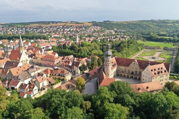 Fototapeta na wymiar Aerial drone shot of the Cityscape of Weikersheim, Germany featuring its famous castle and church