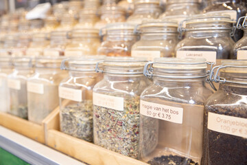Assortiment of different types of tea in jars in a store in the Netherlands