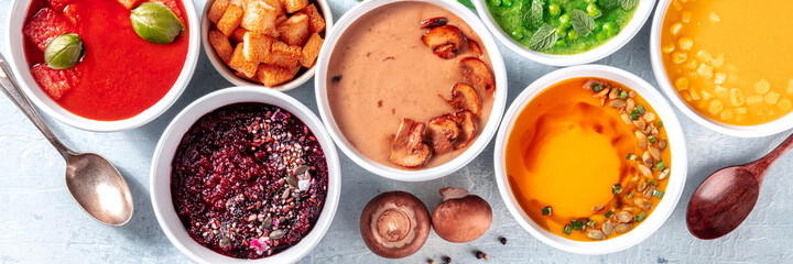 Vegan soup variety panorama with many different cream purees, fresh spring detox meals, top shot