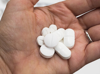 medical tablets in the palm of your hand for the treatment of diseases
