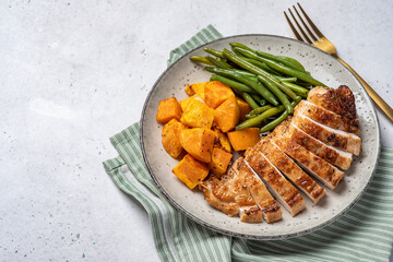 Grilled chicken breast, fillet with sweet potato or pumpkin and green beans, healthy food, top view