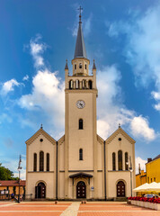 Fototapeta na wymiar Parish church of Saint Catherine of Alexandria at Rynek Market Square in Bytow historic city center in Kaszuby region of Poland