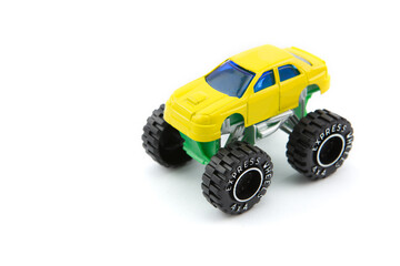 Yellow monster truck or monster car isolated on white
