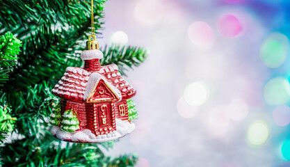 Christmas tree with Christmas decorations and defocused colorful lights in the background