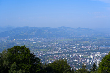 Beautiful scenic mountain panorama seen from local mountain Pfänder on a sunny summer day. Photo taken August 15th, 2021, Bregenz, Austria.