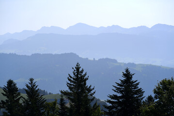 Beautiful scenic mountain panorama seen from local mountain Pfänder on a sunny summer day. Photo taken August 15th, 2021, Bregenz, Austria.