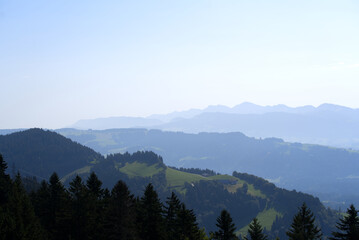 Beautiful scenic mountain panorama seen from local mountain Pfänder on a sunny summer day. Photo taken August 15th, 2021, Bregenz, Austria.
