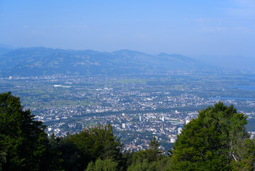 Aerial view of Bregenz seen from local mountain Pfänder on a sunny summer day. Photo taken August 15th, 2021, Bregenz, Austria.