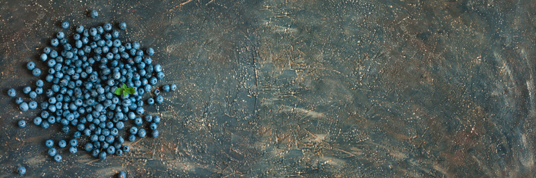 scattering of fresh blueberries with copy space for your text. Healthy food and vegetarianism concept. Top view, selective focus