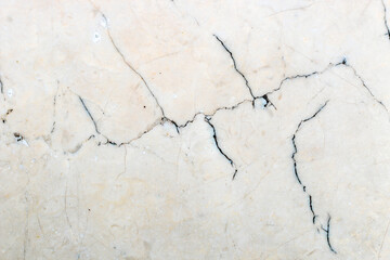 smooth marble wall texture with dark stripes.