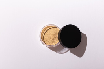 Mineral powder foundation isolated on a white background. Eco-friendly and organic beauty products