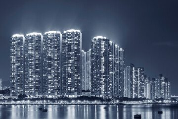 Fototapeta na wymiar High rise residential building in Hong Kong city at night