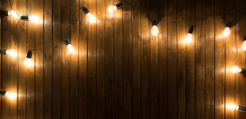 Light bulbs on dark Wooden Background
