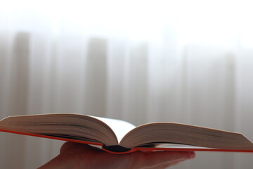 open book on hand
