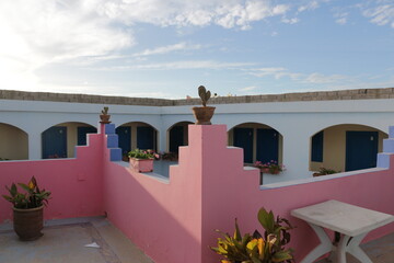 pink wall with rectangular shaped architecture in mirleft, morocco, moroccan style