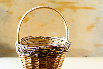 empty wooden wicker basket on wooden background