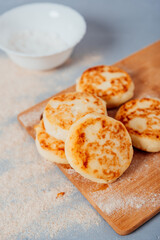 Cottage cheese cheesecakes on a wooden board