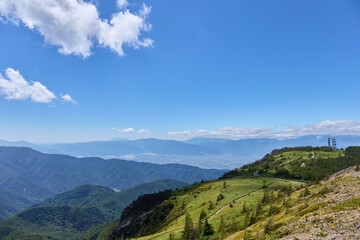 Fototapeta na wymiar 8月下旬（夏） 美ヶ原高原の王ヶ頭から見た松本盆地と山々の風景 長野県