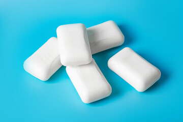 Global Handwashing Day. Hygiene concept, background. Several bars of white soap lie on a blue background.