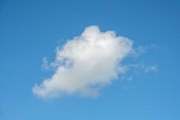 A white cloud floating in the blue sky