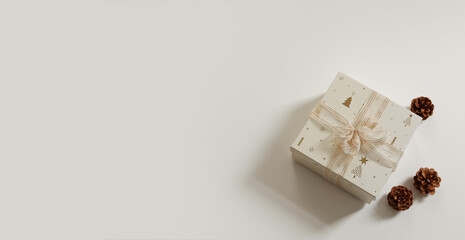 Christmas composition. Xmas background. Christmas gift, pine cones on the white background. Free space for text, copy space. Flat lay, top view