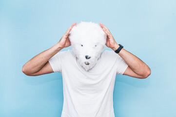 Man with polar bear mask making gesture of concern.