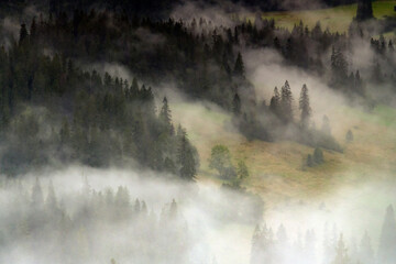 Fototapeta premium Morning mists on the Podhale slope. Mountain landscape. Podhale and Tatra Mountains views.