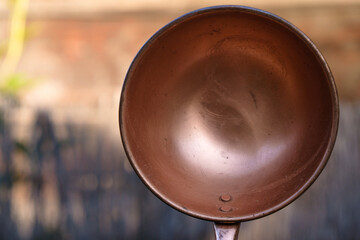 Handmade soup ladle. Rivets on the copper ladle. Close up. 