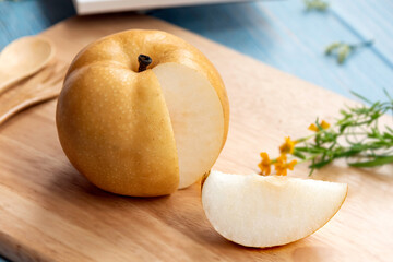 Chinese pear friut, Nan shui pear is a special of pear,put on wooden table in color cloth.