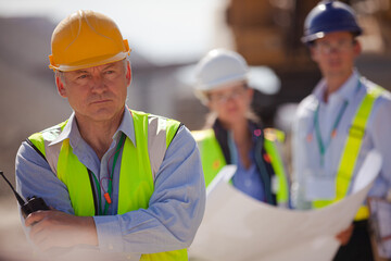 Worker holding clipboard on site