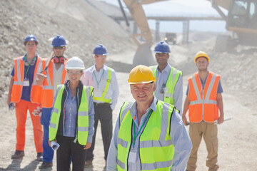 Business people standing in quarry