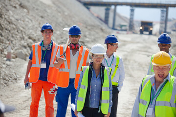 Workers and machinery in quarry
