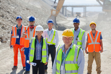 Business people standing in quarry