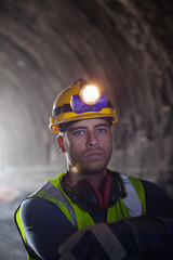 Fototapeta premium Worker using walkie-talkie in tunnel