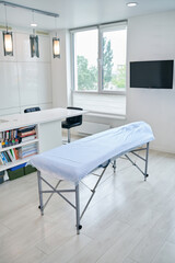 Image of medical couch standing in medical office