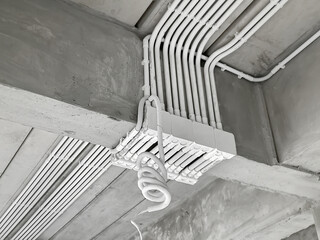 Installation of electrical wiring on the ceiling.Electrical cable system installation.