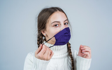 sick and tired. girl need igg immunity test. virus pneumonia. patient child wearing respirator...