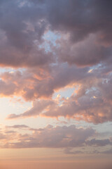 Fototapeta na wymiar Purple cumulus funny clouds in the sunset sky