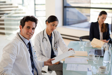 Doctors and businesswoman talking in meeting