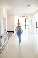 Fototapeta na wymiar Doctor rushing down hospital corridor