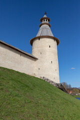 Fototapeta na wymiar Stone tower and wall of the Kremlin of Pskov
