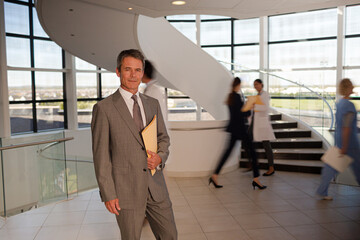 Portrait of smiling businessman in hospital